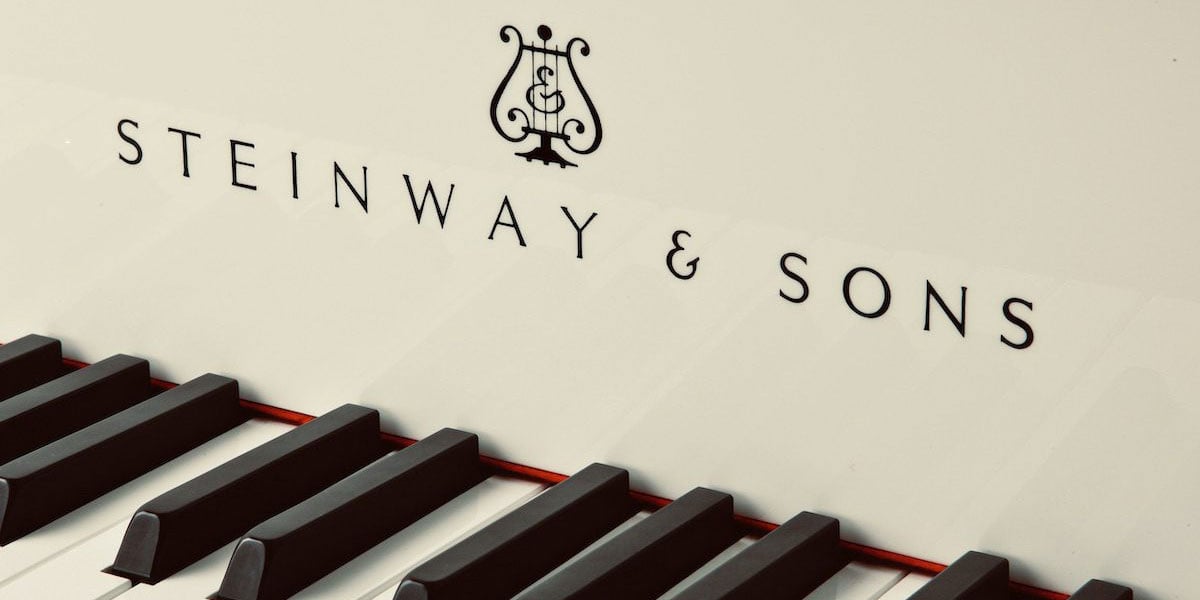 Steinway & Sons Logo On White Piano Keys Front